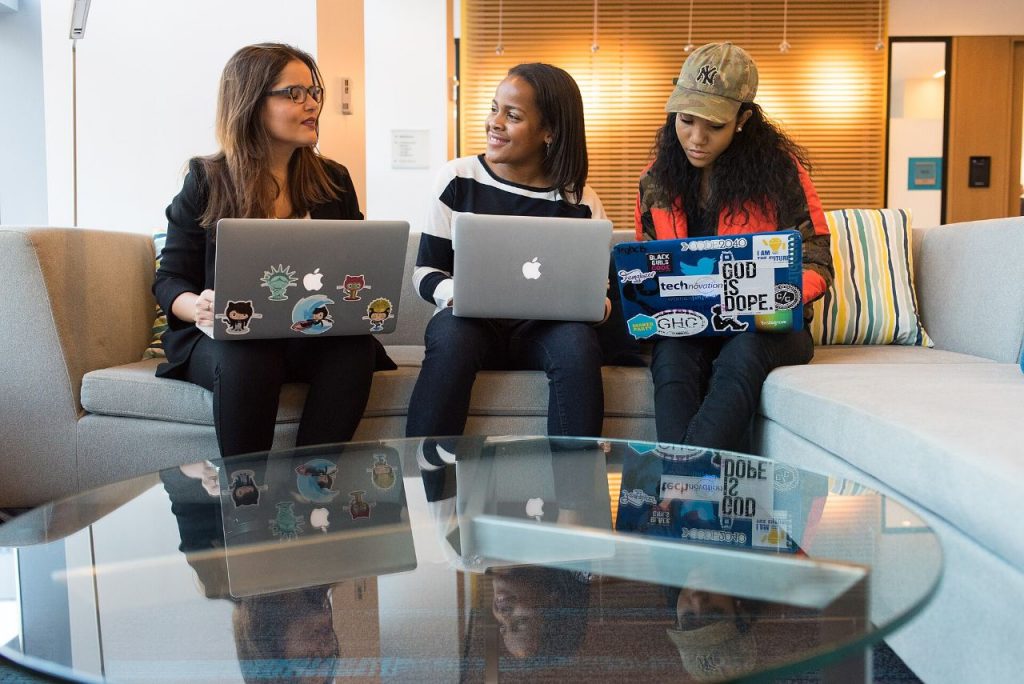 Modern open-plan office where the Adriel Corp development team plans software projects