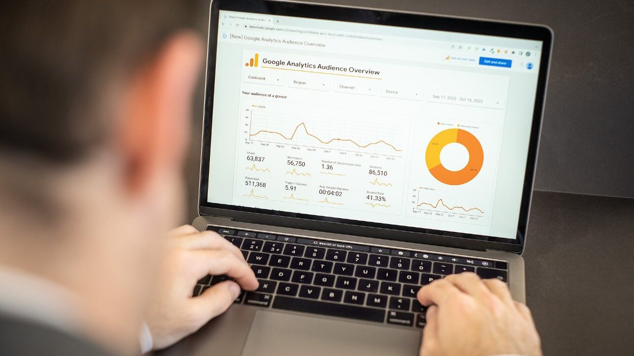 Developer reviewing website performance metrics and search analytics on a monitor