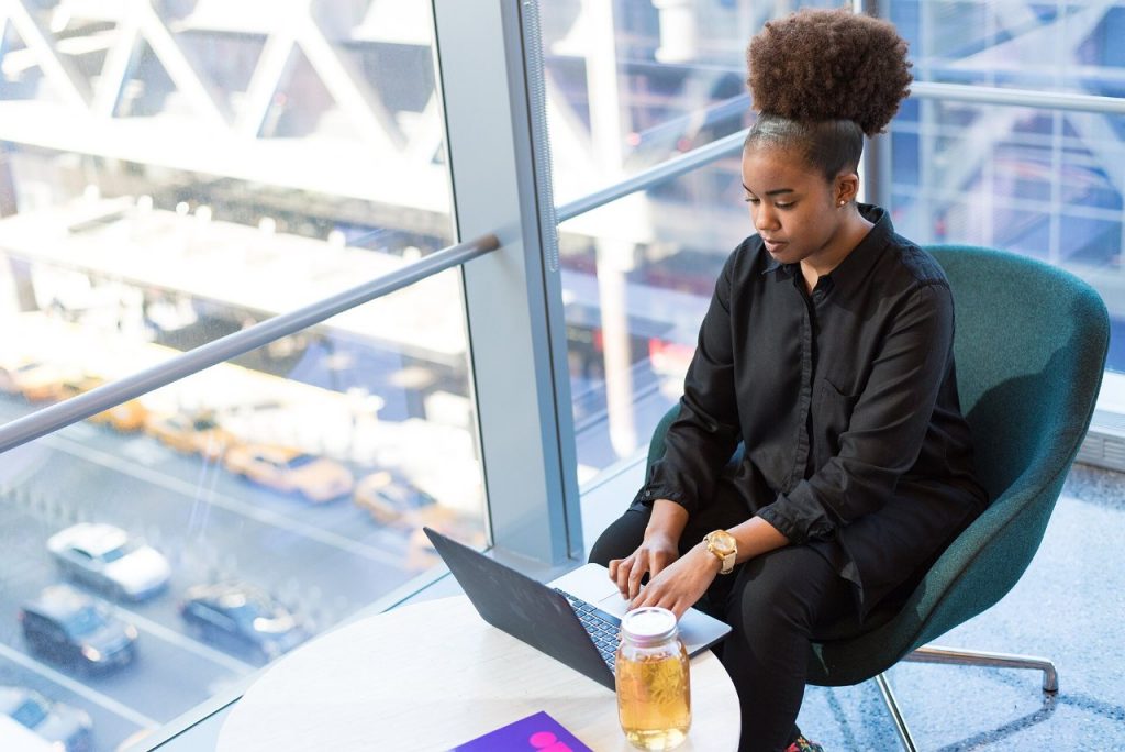 Software developers working together at desks in a bright office